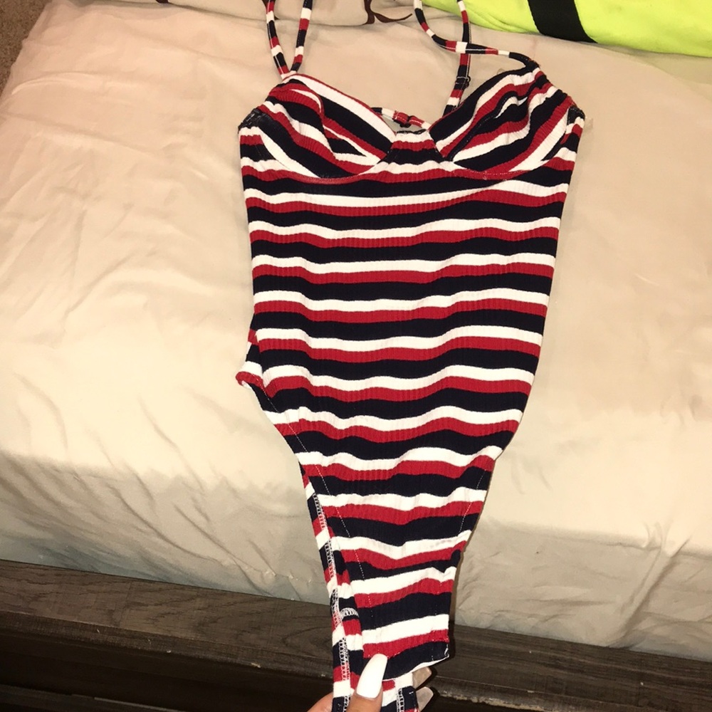 A red, white, and blue bodysuit.